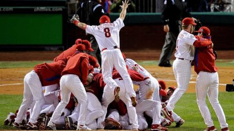 The Phillies celebrate their 2008 World Series win by dog-piling on the mound. Shane Victorino is jumping on the top.