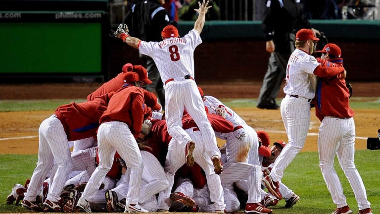 The+Phillies+celebrate+their+2008+World+Series+win+by+dog-piling+on+the+mound.+Shane+Victorino+is+jumping+on+the+top.