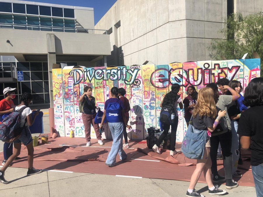 Diversity and Equity sign wall decorated by visiting scools and students attending the EXPO