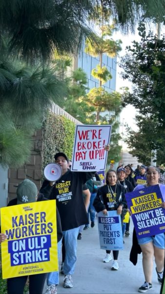 Oct 4, 2023- people holding signs in protest of Kaiser medical care and the low wages of their workers