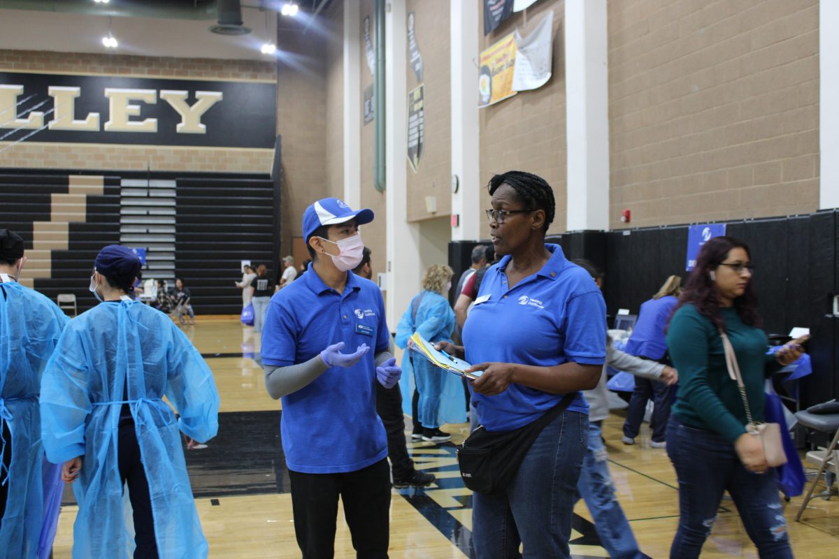 Sep 16, 2023- Event officials consult with health experts at the Santa Clarita health fair inside the Golden Valley High School gym.