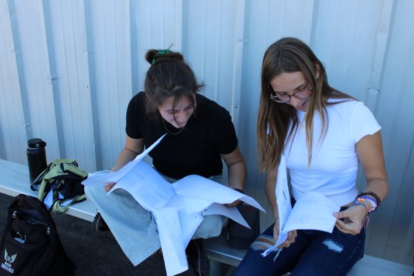 Lyn Howe and Kaylee Davison, student athletes study before practice knowing they wont have time later.