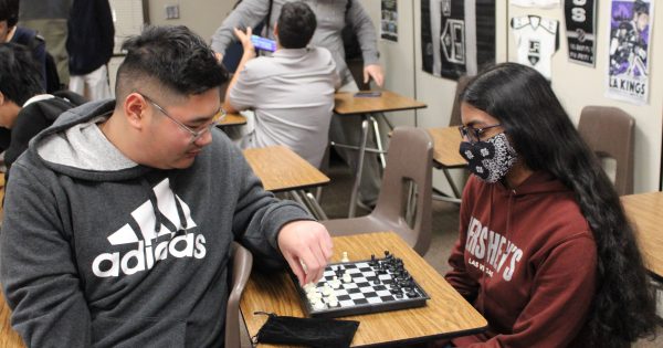 Christopher Ong (Left) and Sarah Zahid (Right) enjoying a game of chess during a club meeting, photo taken on February 2nd, 2024 at Golden Valley High School. (Dylan Vo)