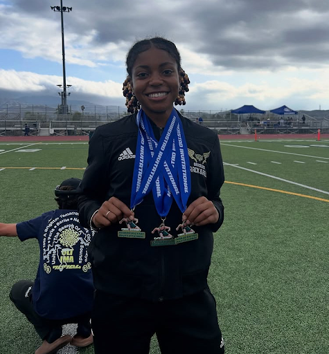 Nyah Fields winning 3 medals at Trevor Habberstad Invitational. 
